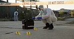 Person, forensic and sample of crime scene with evidence outdoor, dna investigation and murder inspection. Team, hazmat and police tape for blood review, swab observation and documentation protocol 