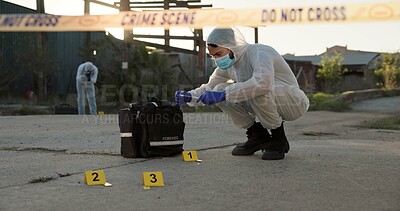 Buy stock photo Person, forensic and sample of crime scene with evidence outdoor, dna investigation and murder inspection. Team, hazmat and police tape for blood review, swab observation and documentation protocol 