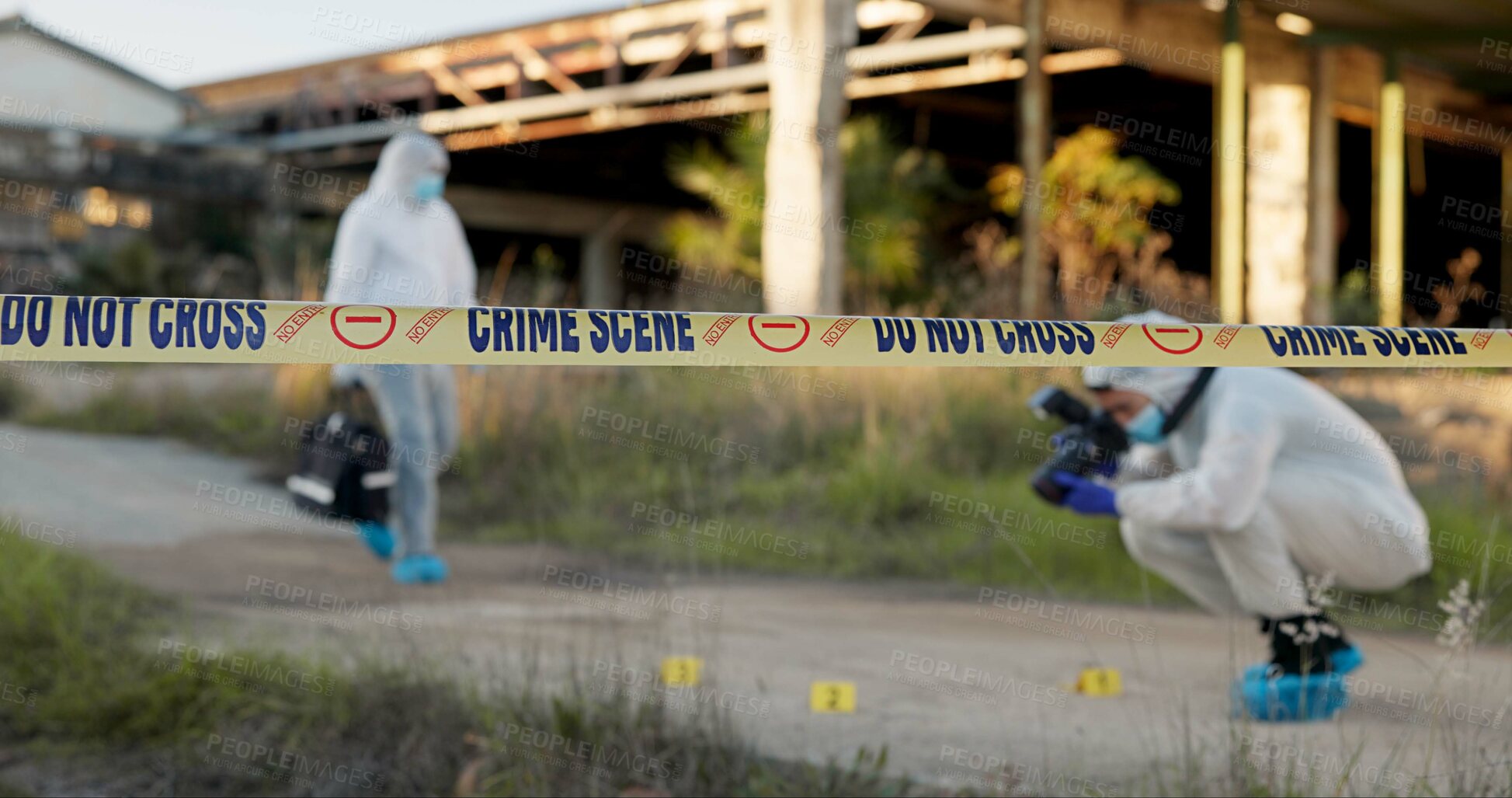 Buy stock photo Crime scene, people and tape outdoor for forensics, evidence photography and investigation. CSI team, hazmat suit or camera in field for inspection, observation or documenting proof at police markers