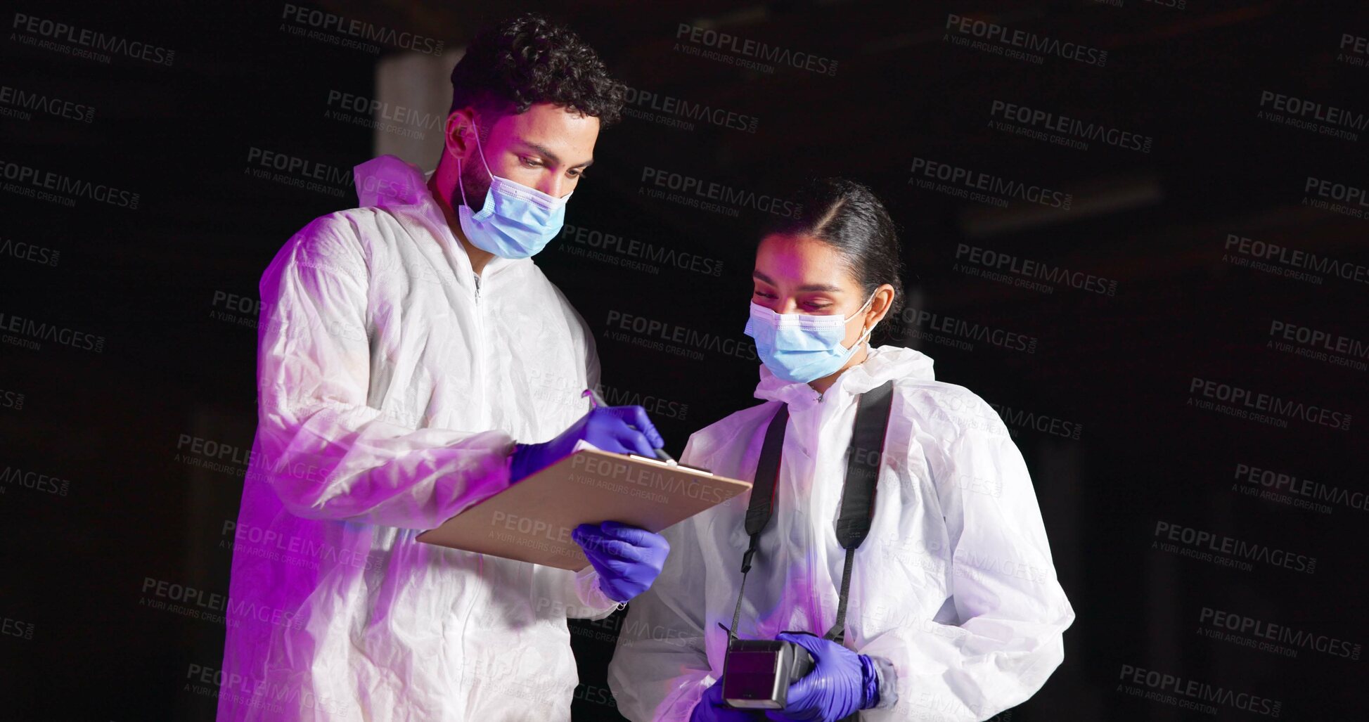 Buy stock photo Forensics team, people and crime scene investigation with clipboard, writing report or evidence at night. Investigators, man or woman with police outdoor for discussion, planning or clues for mystery