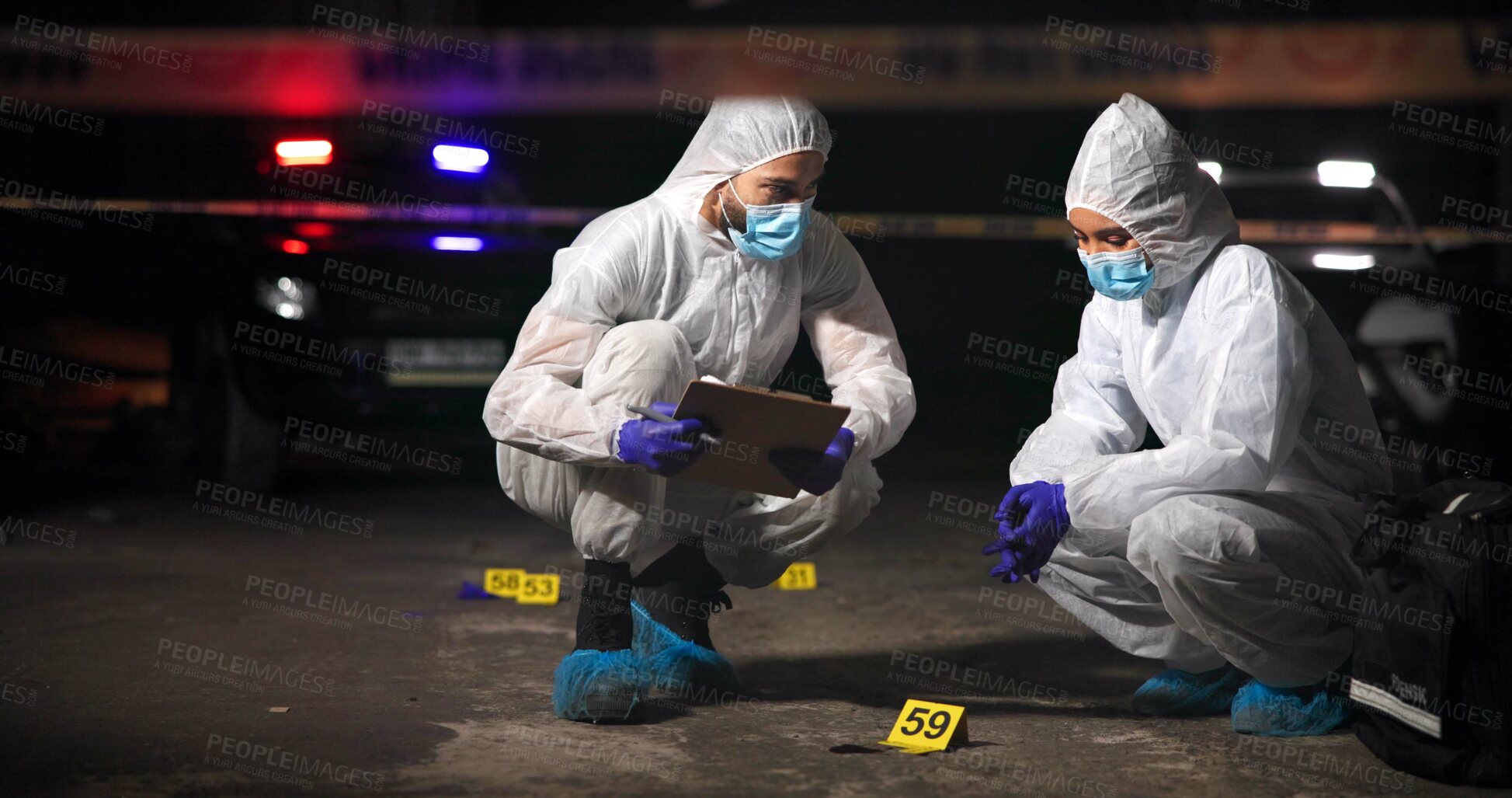 Buy stock photo Forensics team, outdoor and crime scene investigation with clipboard, report or evidence collection at night. Investigators, police and people in city for murder case, discussion or mystery clues