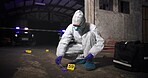 Person, swab and law investigation at crime scene, blood sample and discovery of dna marker. Professional, homicide evidence and hazmat suit for safety, night and search for clues with forensics