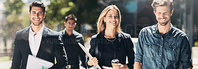 Buy stock photo Shot of corporate colleagues walking down the street