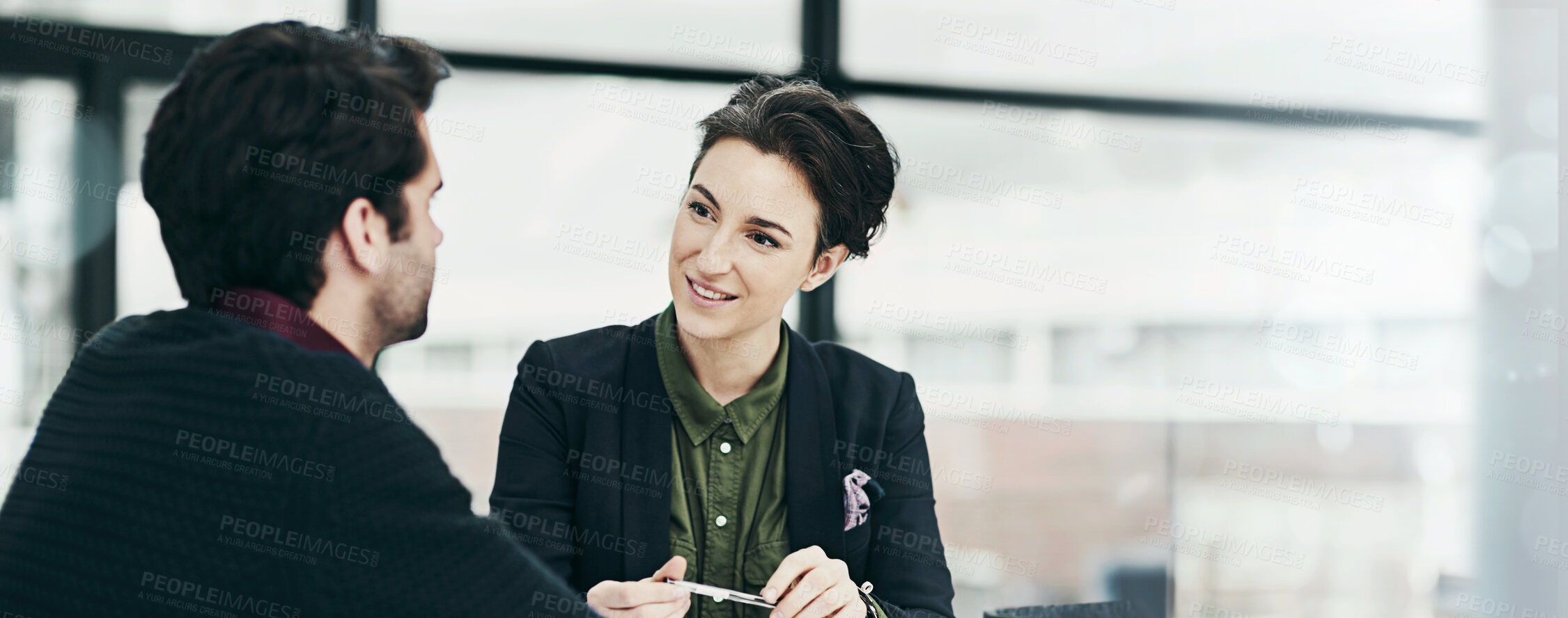 Buy stock photo Cropped shot of a businesswoman conducting an interview with an unidentifiable candidate in her office