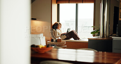 Buy stock photo Woman, laptop and relax by window for calm, ebook and social media on weekend with website. Female person, subscription and comfort in home for lazy day, break and streaming in apartment with movie