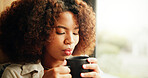 Woman, morning and blowing coffee by window in home, relax and memory with drink at apartment. Person, reflection and thinking with cup for tea, latte and perspective with caffeine beverage in house