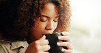 Woman, morning and drinking coffee by window in home, relax or insight for memory at apartment. Person, reflection and thinking with cup for tea, latte and perspective with caffeine beverage in house