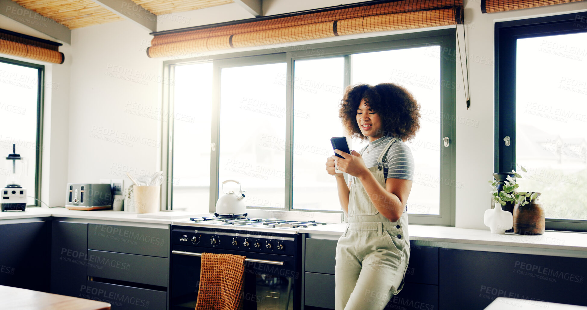 Buy stock photo Woman, coffee and smile with phone in kitchen for social media scroll, web surfing or reading online news. Girl, morning and happy person with smartphone for dating site and text message in apartment