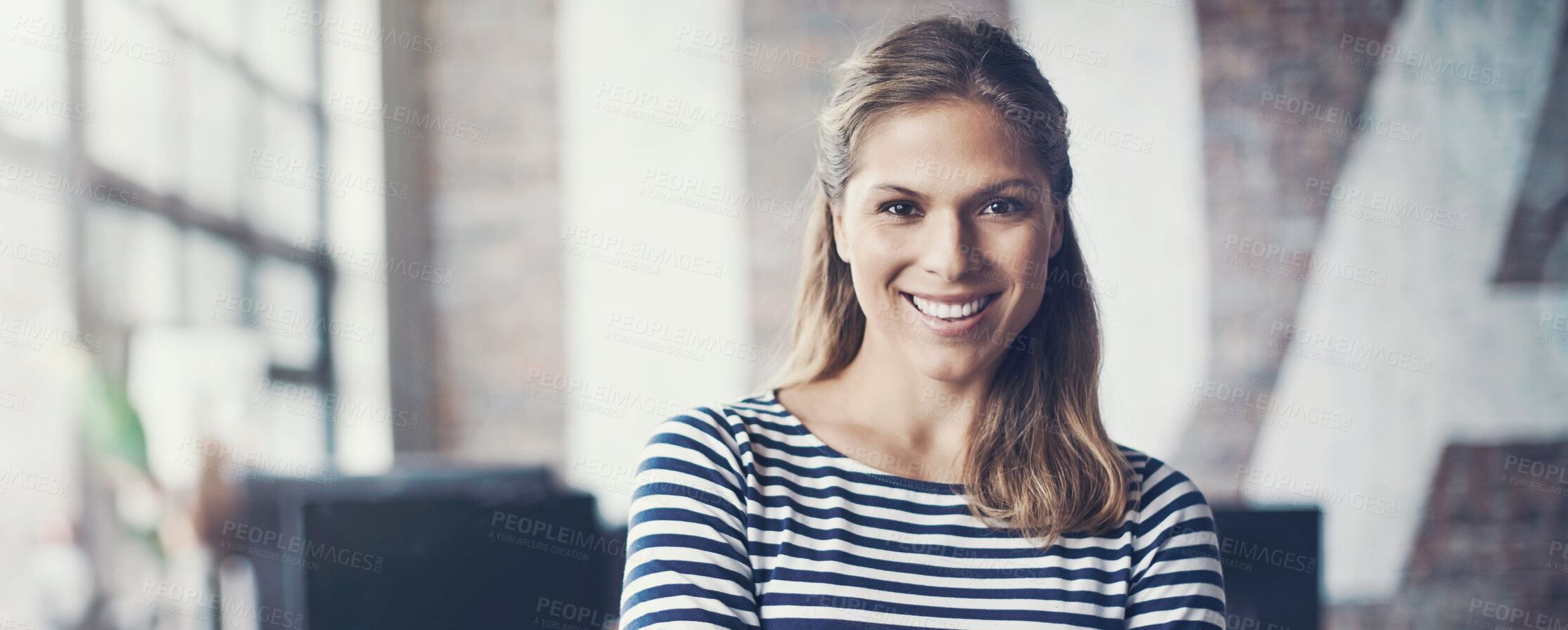 Buy stock photo Cropped shot of an attractive young designer standing in her office