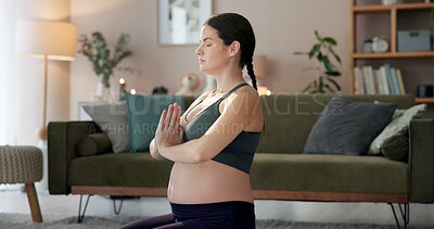 Buy stock photo Meditation, prayer hands and zen with pregnant woman in living room for yoga, fitness and holistic wellness. Calm, pregnancy health and pilates with profile of person at home for relax and prenatal