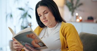 Buy stock photo Pregnant woman, book and reading on couch for information, parent knowledge and wellness. Future mother, home and literature for pregnancy education, fetal development and advice for newborn care
