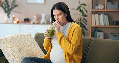 Buy stock photo Pregnant woman, drinking and thinking with green smoothie for nutrition, digestive health and wellness on sofa. Future mother, stomach and person with juice for diet vitamins or immune system boost