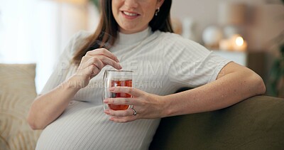 Buy stock photo Tea, relax and smile with pregnant woman, sofa and living room of home for maternity leave wellness. Break, warm drink and future mother with detox glass, apartment and comfort for pregnancy or rest