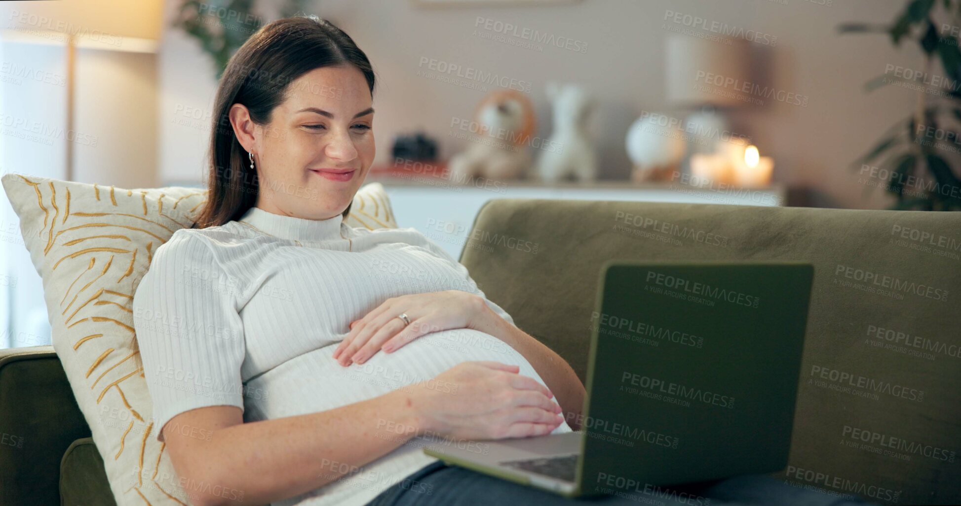 Buy stock photo Laptop, hand on stomach and pregnant woman relax with streaming, movies or film on home sofa. Pregnancy, research and mom with internet search, prenatal website or social media motherhood advice