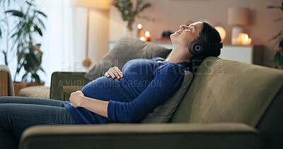 Buy stock photo House, calm and pregnant woman on sofa, headphones and listening to music in living room. Apartment, pregnancy and person on couch, stomach or peace with wellness, sound and radio in lounge