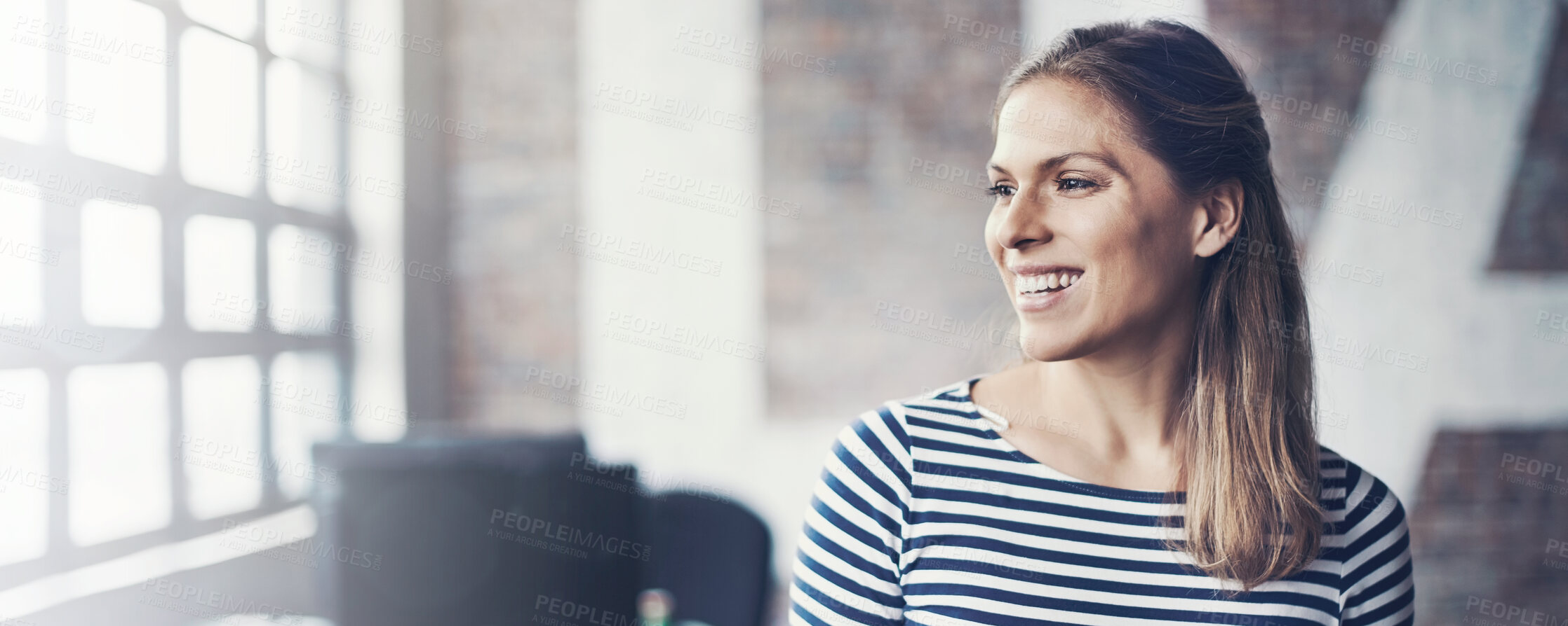 Buy stock photo Shot of a young designer using her digital tablet in her office