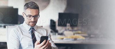 Buy stock photo Cropped shot of a businessman using his cellphone while sitting in his office