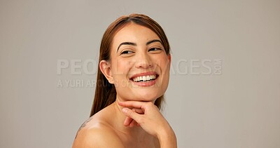 Buy stock photo Skincare, natural beauty and happy woman with glow, dermatology and space on gray studio background. Face, smile and model with makeup, cosmetics and thinking of spa facial treatment for aesthetic