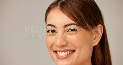 Buy stock photo Skincare, beauty and portrait of happy woman with glow, dermatology or shine closeup on gray studio background. Face, smile or model with makeup, natural cosmetics or pimple treatment on mockup space