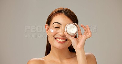 Buy stock photo Container, smile and woman with cream, skincare and dermatology on gray studio background. Person, model and girl with happiness, cosmetics and aesthetic with creme, healthy skin and grooming routine