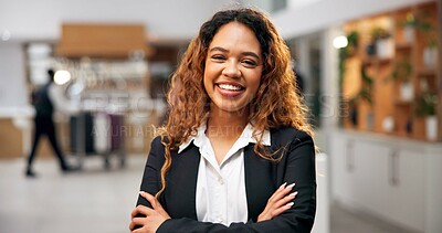 Buy stock photo Woman, portrait and arms crossed of manager in hotel, customer service and friendly concierge. Female person, lobby reception and proud assistance in front desk, hospitality and lodge receptionist