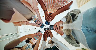 Buy stock photo People, circle and phones for college registration, online and teamwork in education on campus. Students, low angle and huddle for project solidarity in university, collaboration and communication