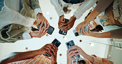 Buy stock photo People, circle and phones for university registration, online and teamwork in education on campus. Students, low angle and huddle for project solidarity in college, collaboration and united learning