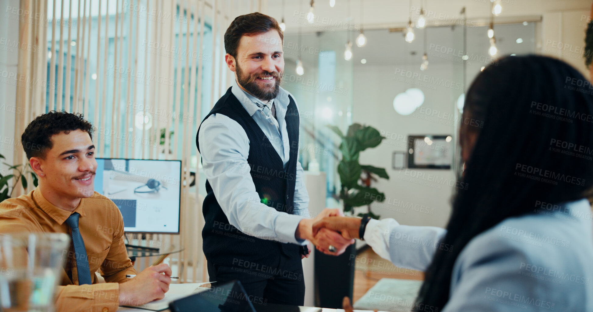 Buy stock photo Man, woman and handshake at meeting in office for welcome, smile and collaboration at media company. Business people, group and shaking hands with b2b agreement, deal and happy at creative agency