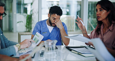 Buy stock photo Man, nurse and headache with stress in meeting for anxiety, overworked or fatigue at hospital. Male person, migraine and burnout with documents in team discussion for bankruptcy, debt or vertigo