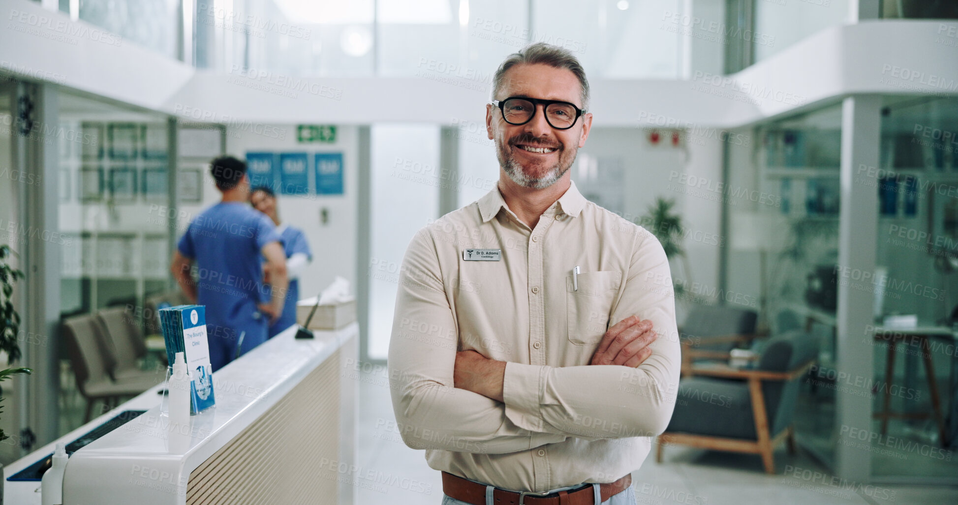 Buy stock photo Doctor, portrait and hospital with chief, arms crossed and manager at clinic with smile. Mature, medical and leader with confidence and pride from healthcare, about us and success with integrity