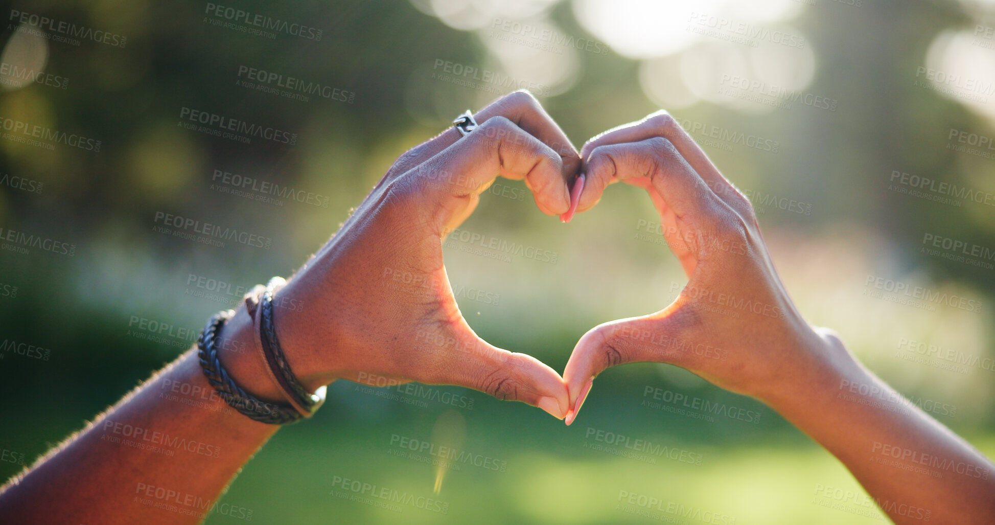 Buy stock photo Love, heart and hands of couple in nature with gesture for support, trust and commitment on date outdoors. Emoji, symbol and people with shape together for bonding, relationship and care in park
