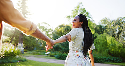 Buy stock photo Holding hands, spring and smile with black couple in nature for romance, honeymoon date and bonding together. Celebration, happiness and love with woman in park for relationship, support and care
