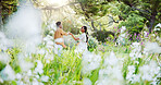 Dance, spring and love with black couple in nature for romance, honeymoon date and bonding together. Celebration, happiness and flowers with man and woman in park for relationship, support and care
