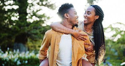 Buy stock photo Happy, piggy back and black couple in park together for bonding, playful relationship and affection in nature. Relax, dating and man and woman outdoors for romance, love and commitment on weekend