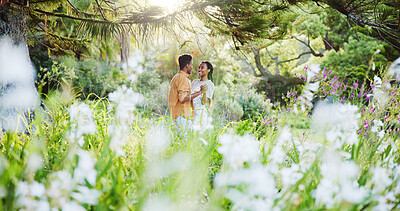 Buy stock photo Dance, smile and love with black couple in nature for romance, honeymoon date and bonding together. Celebration, happiness and flowers with man and woman in park for relationship, support and care
