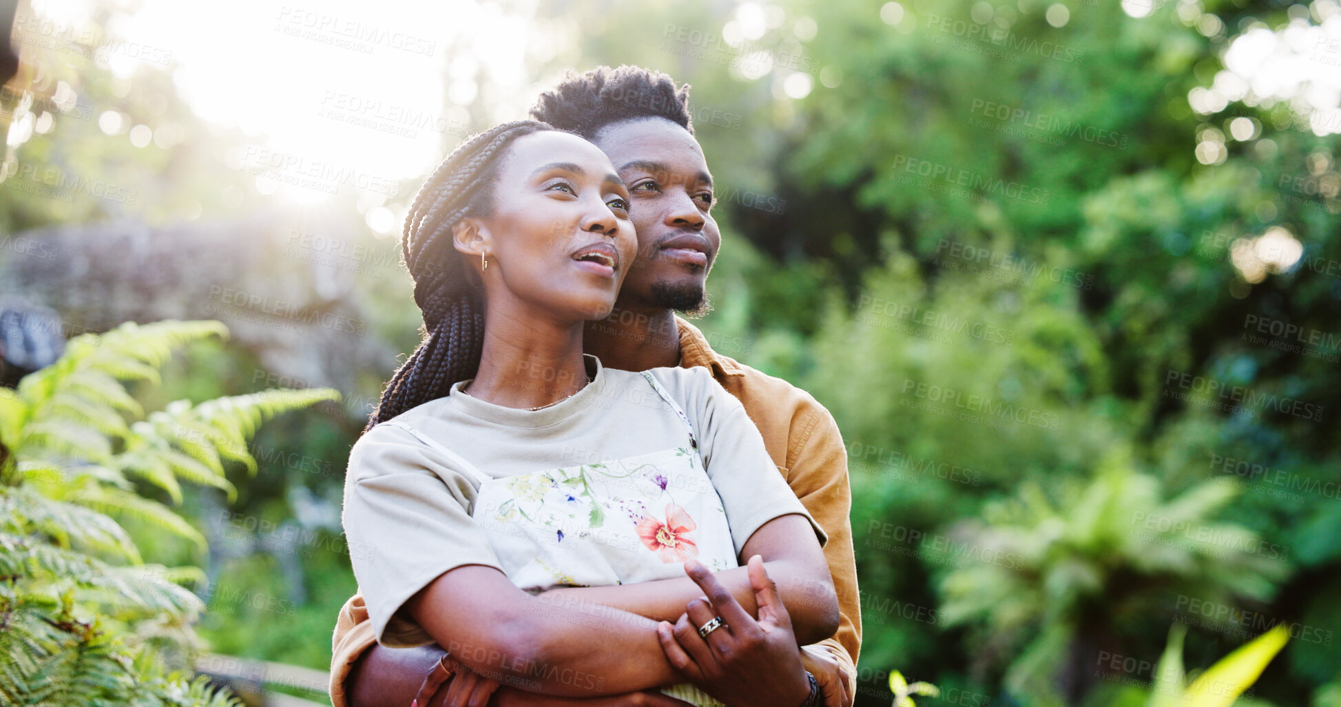 Buy stock photo Nature, hug and black couple at park with relax, view and holiday in spring with date and love. Care, support and happy people in urban garden with calm bonding, outdoor and vacation together