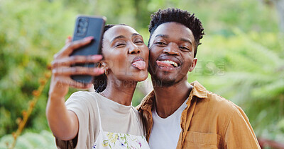 Buy stock photo Black couple, outdoor and silly selfie in park with holiday, funny and tongue out together with social media and smile. Happy, people and bonding on summer vacation with profile picture in garden
