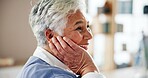 Senior woman, patient and happy at doctor office with goods news or feedback on diagnosis. Female person, clinic and smile or satisfied on healthcare consultation, assessment and appointment