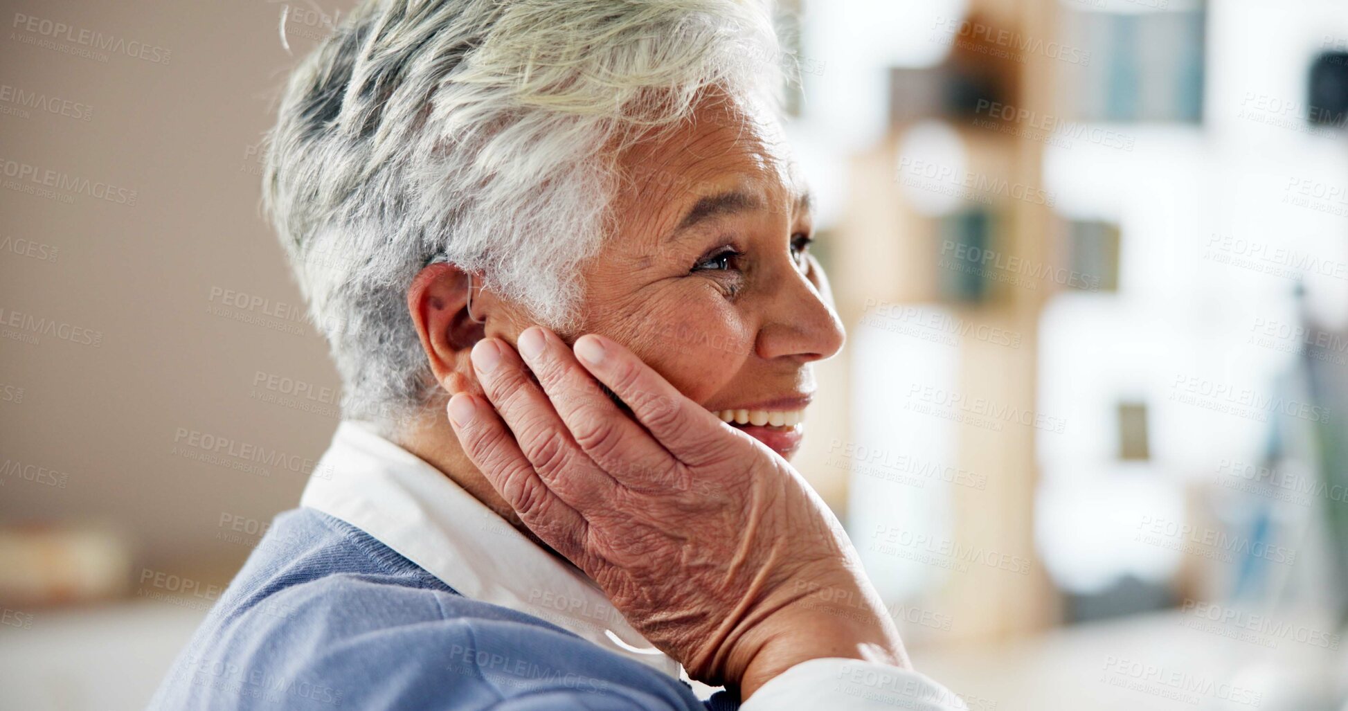 Buy stock photo Senior woman, home and happy with hearing aid on ear for audio, listening and healthcare as pensioner. Elderly lady, retirement and person with a disability with smile or satisfied for sound implant