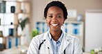 Black woman, doctor and smile in portrait at clinic with pride, confidence and services with healthcare. African medic, person and happy for career with wellness, excited and hospital in Nigeria