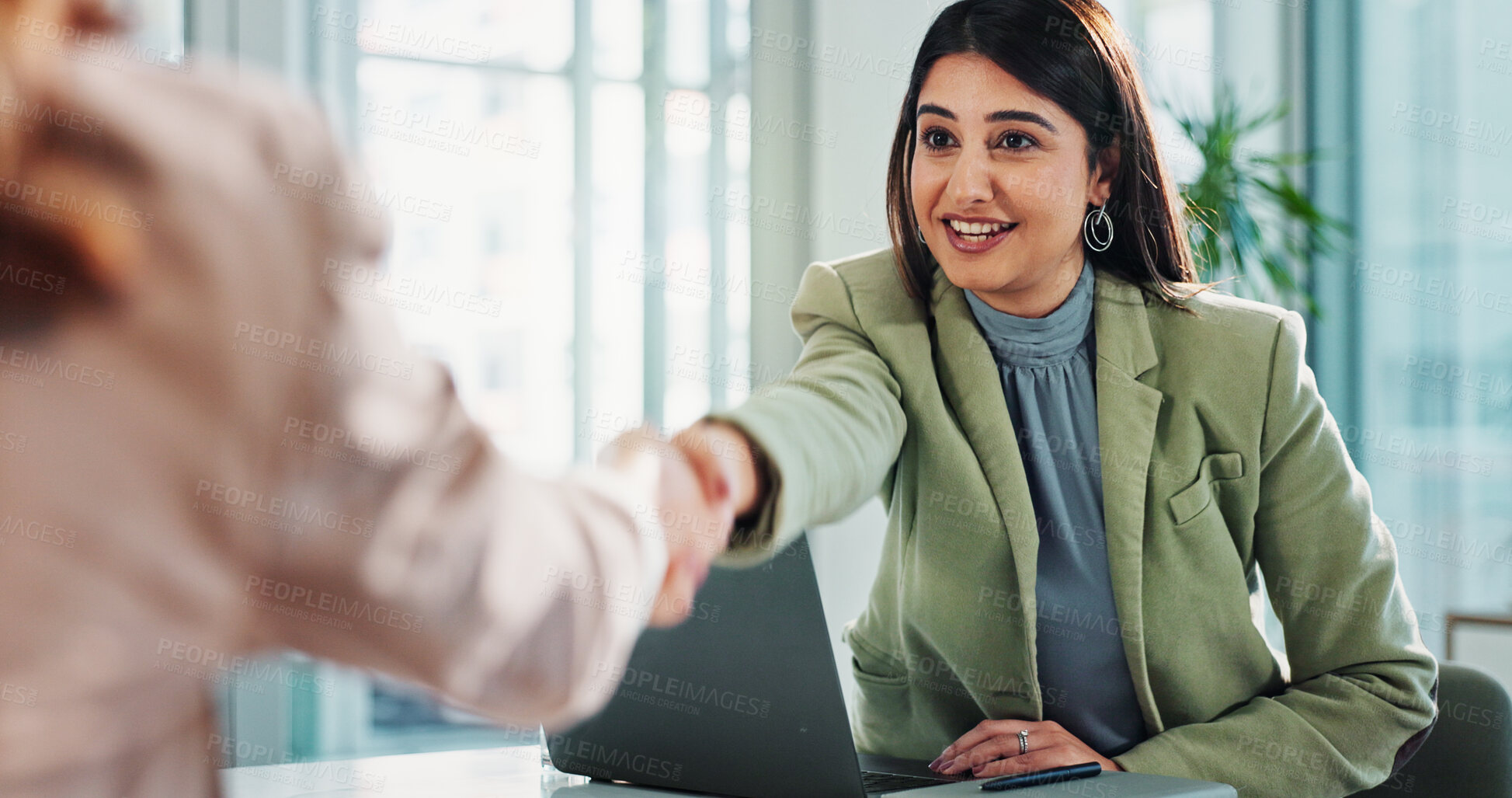 Buy stock photo Handshake, business woman and laptop in office for welcome, thank you and introduction for company. HR interview, people and gesture in meeting for recruitment goals, IT partnership or b2b contract