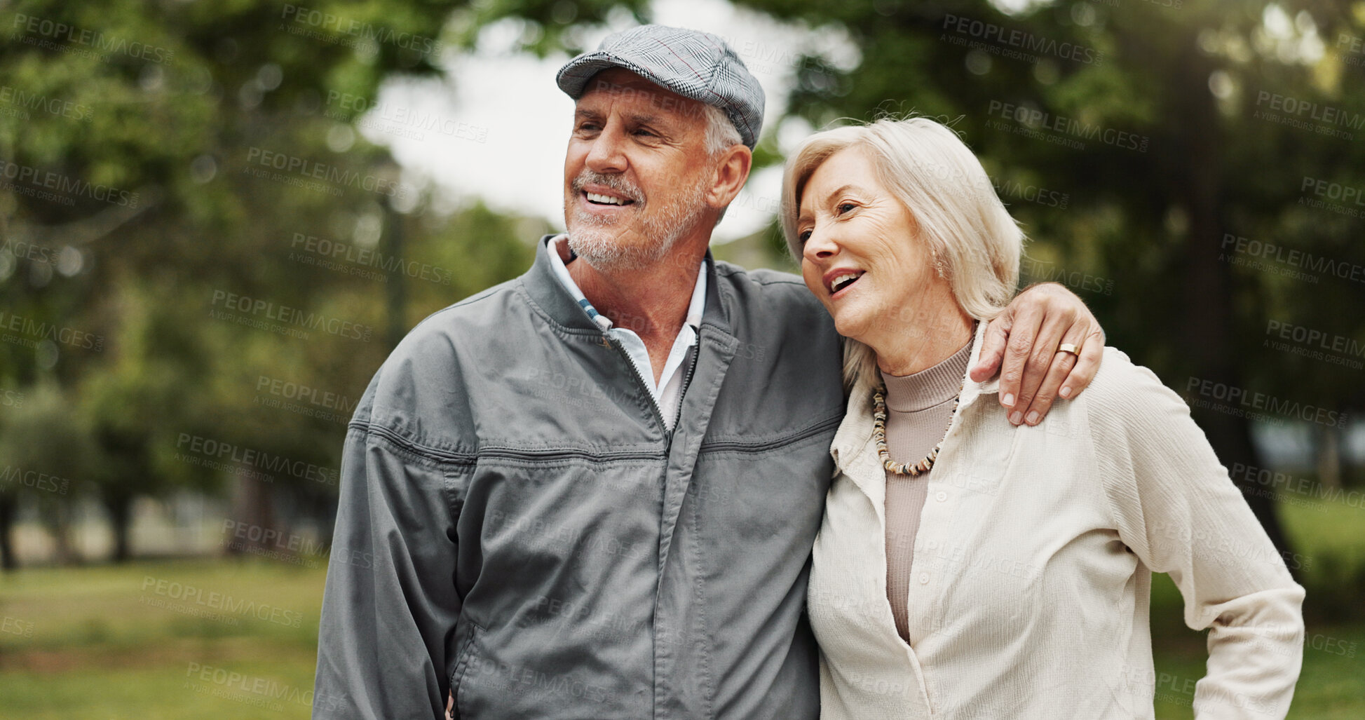 Buy stock photo Park, senior couple and happy with hugging on walk routine for retirement, support and bonding in Germany. People, relationship and smile outdoor for break, care and love as pensioner for date