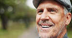 Park, mature man and happy with thinking on walk for break, mental health and nostalgic. Male person, park and thoughts for retirement in nature for calm, rest and reflecting with memories with smile