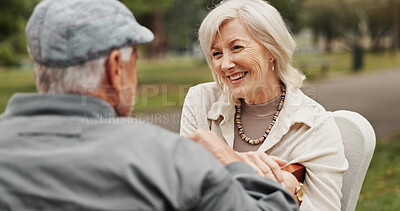 Buy stock photo Senior couple, speaking and smile in park for bonding, conversation and commitment together outdoors. Retirement, marriage and mature man and women in nature on bench for love, care and connection