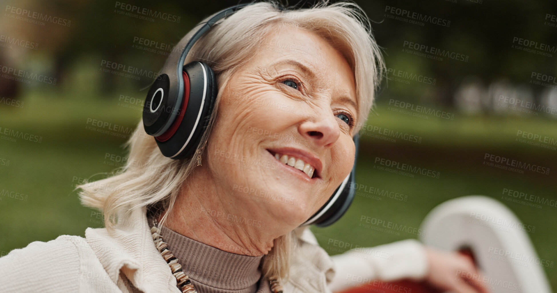 Buy stock photo Senior, happy woman or headphones with music at park for audio streaming or radio podcast in nature. Mature, female person or earphones with smile in joy for sound, listening or outdoor entertainment