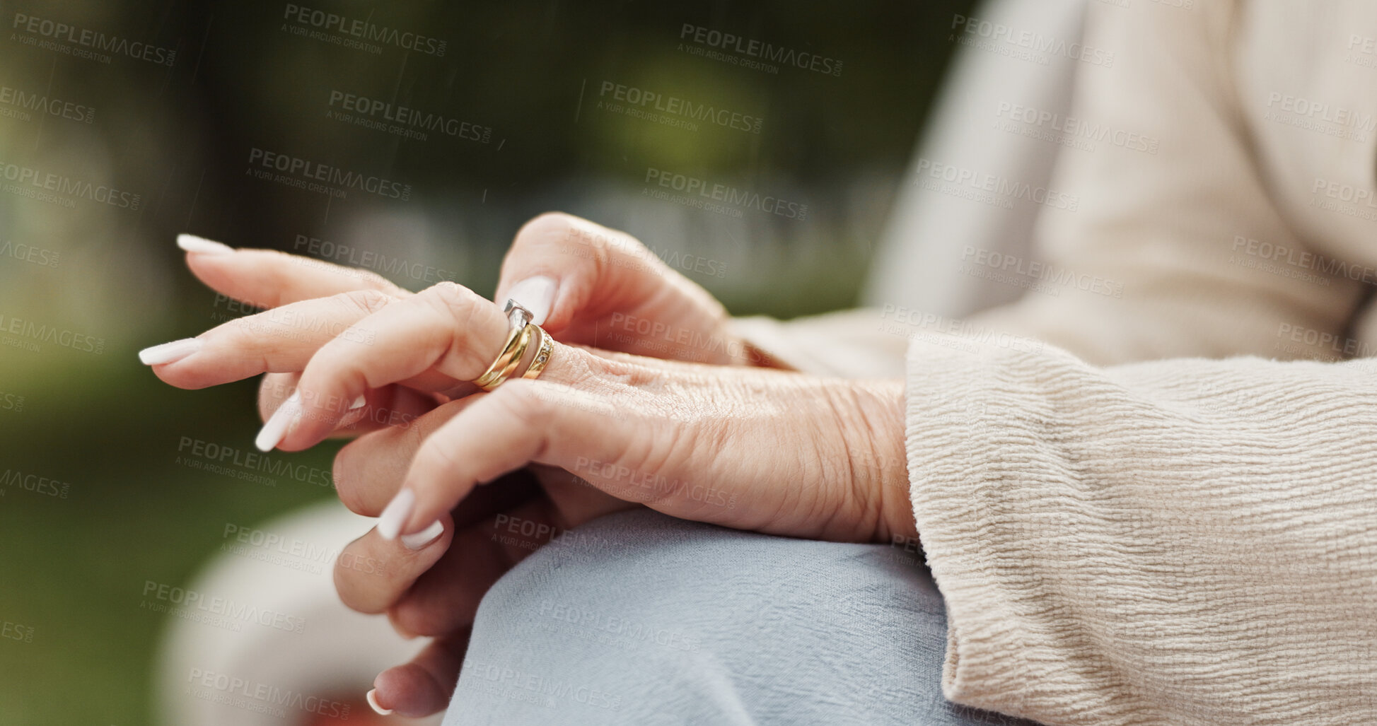 Buy stock photo Elderly woman, hands and ring with memory for commitment, marriage and nostalgia for love at park. Closeup, senior person and playing with jewelry for divorce, thinking and promise with gold