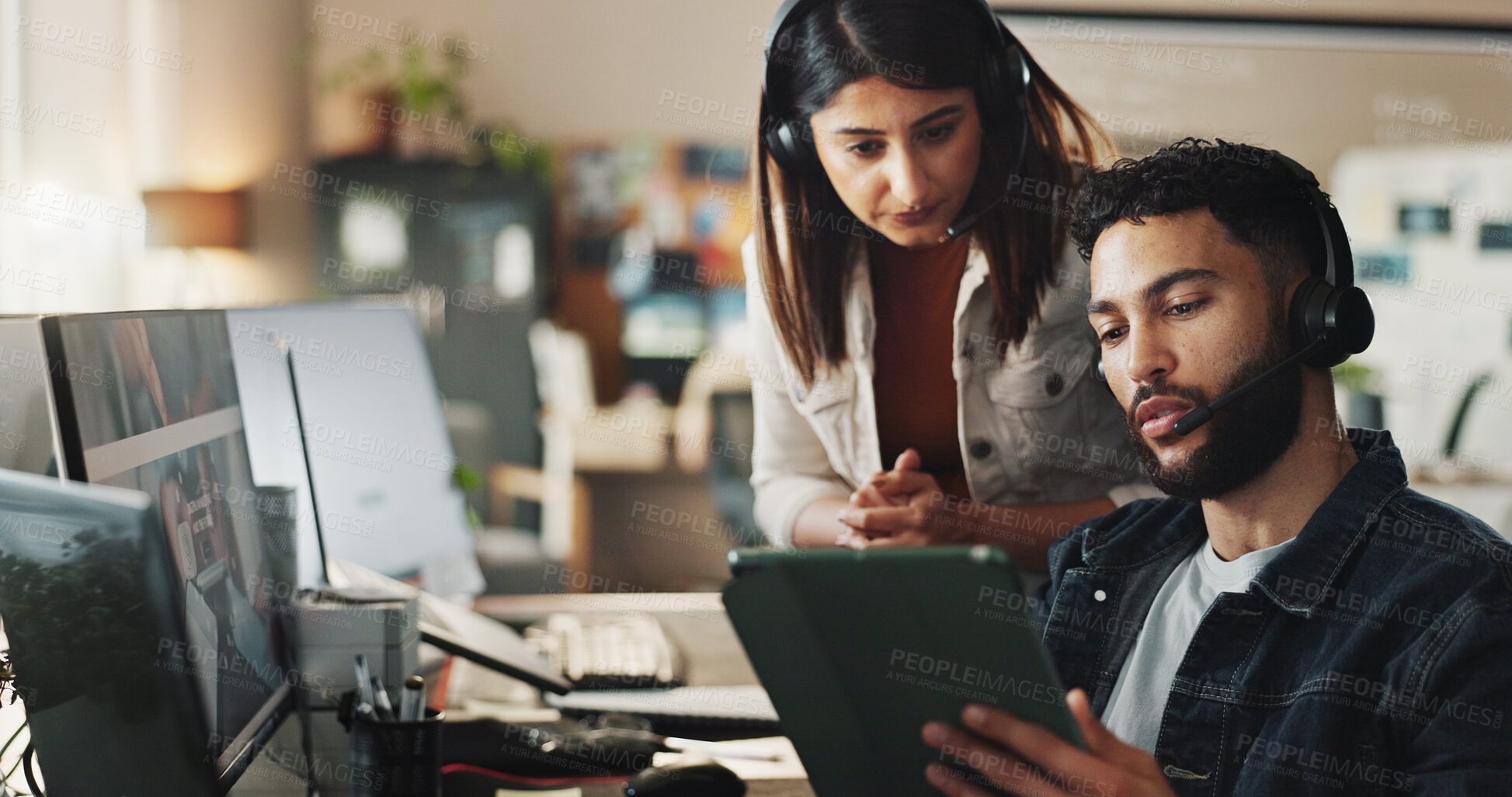 Buy stock photo Call center, woman and man with training, tablet and online advice in technical support office. Manager, customer service and IT consultant with headset, computer and help on digital app for teamwork