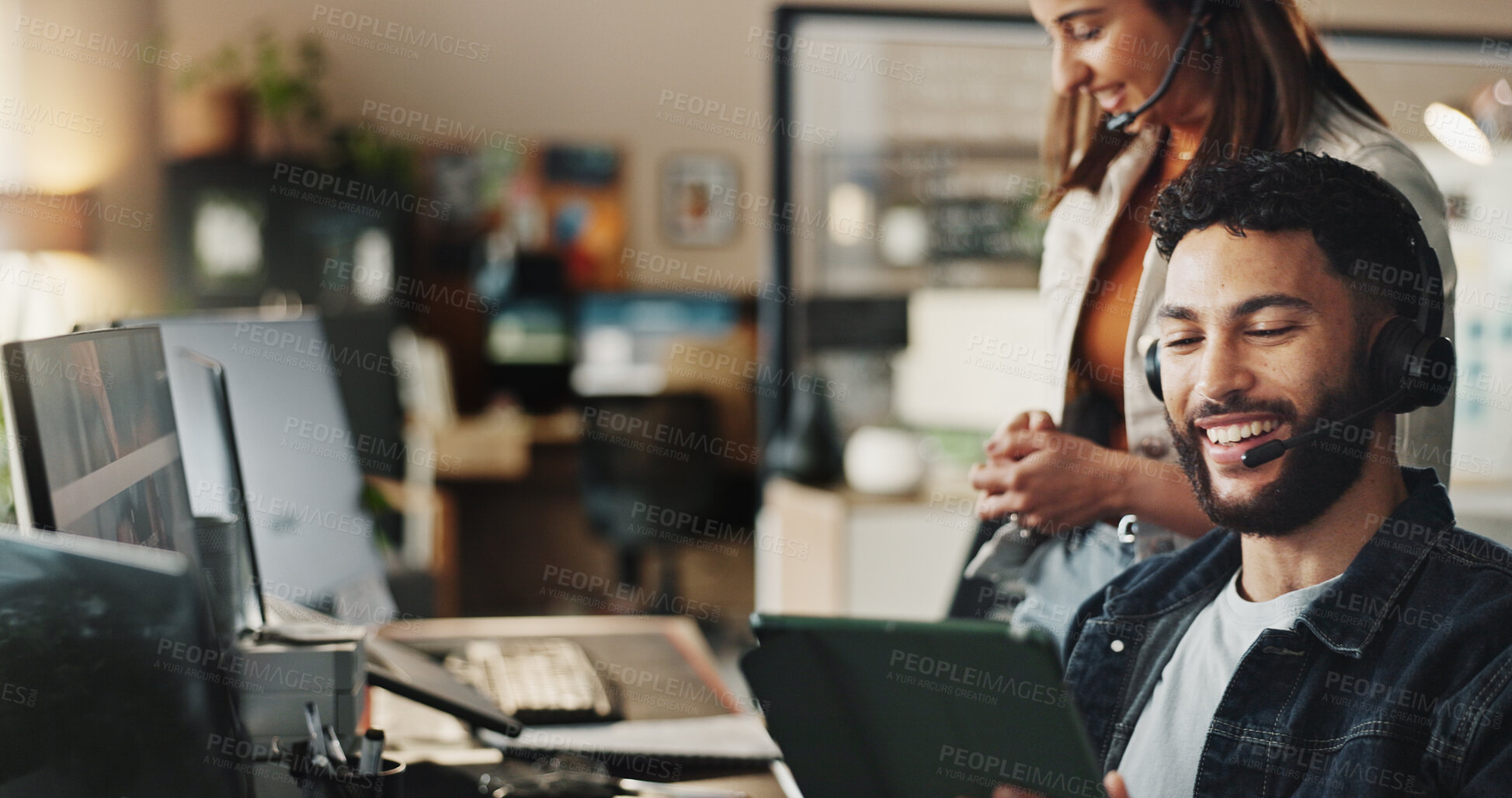 Buy stock photo Headset, tech support and man in coworking office with smile, online advice and website management. Virtual assistant, customer service and IT consultant at desk with computer, tablet and phone call