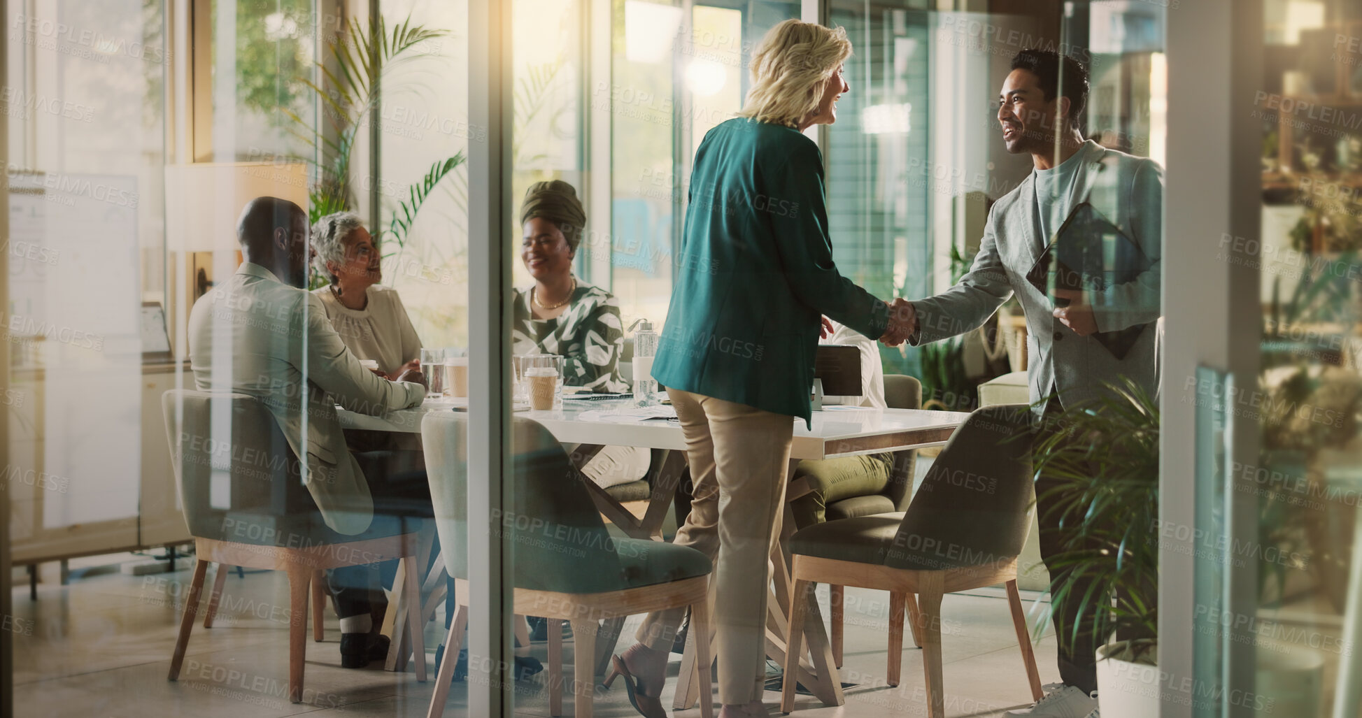 Buy stock photo Handshake, meeting and partnership with business people in boardroom of glass office together. Deal, thank you and welcome with employee team shaking hands in corporate workplace for agreement