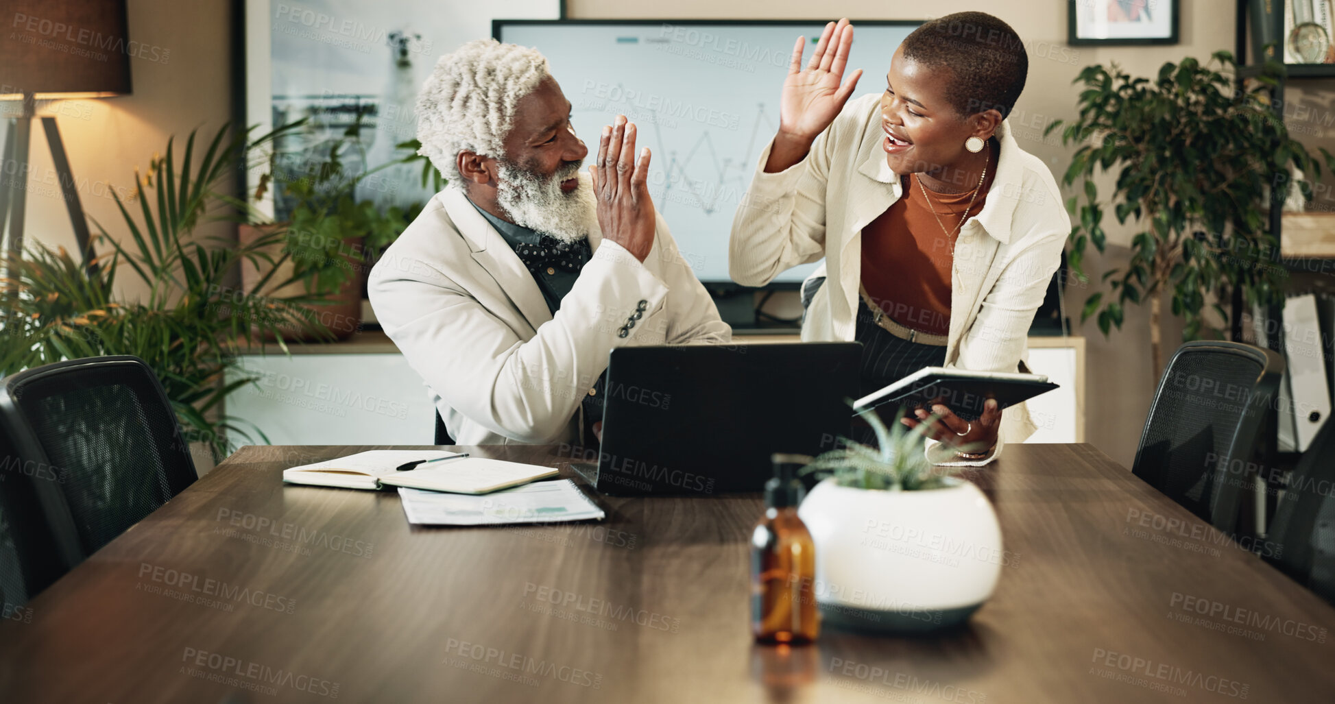 Buy stock photo Business people, laptop and high five with teamwork for profit, winning or success at office. Businessman, woman or colleagues with technology for revenue, financial increase or corporate finance